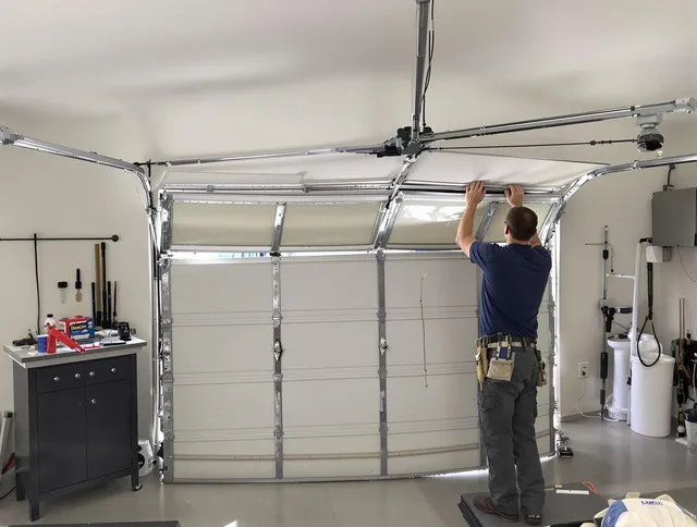 New Canaan Garage Door Repair specialist performing precise section replacement on New Canaan garage door
