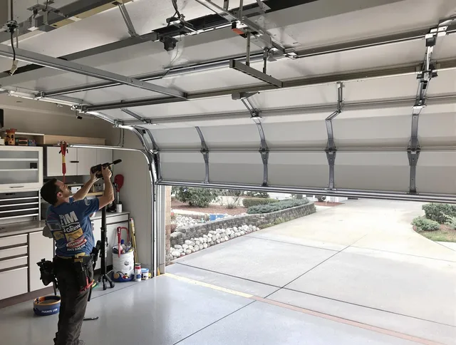 Garage door track repair service by New Canaan Garage Door Repair in New Canaan